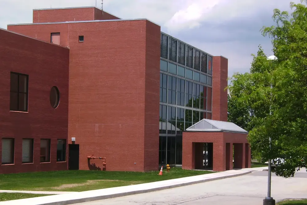 Red brick Jefferson Hills Municipal Center with a glass stairwell and covered entrance in Jefferson Hills, Pennsylvania