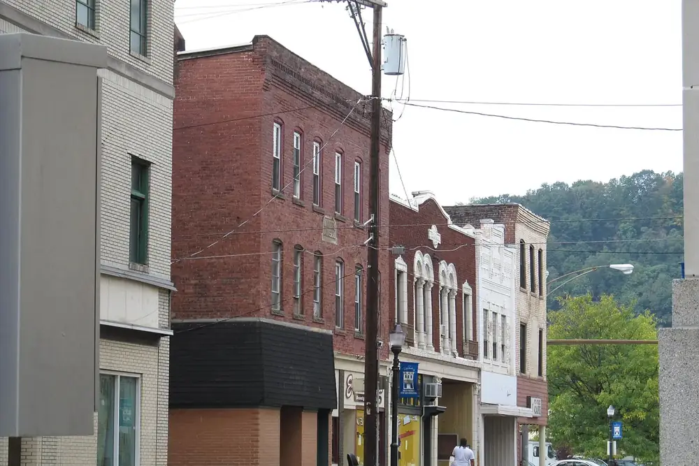 Row of historic brick storefront buildings along a street in downtown New Kensington, Pennsylvania